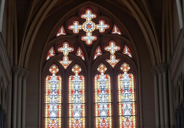 Close up of intricate stone carvings and stained glass in a Gothic cathedral